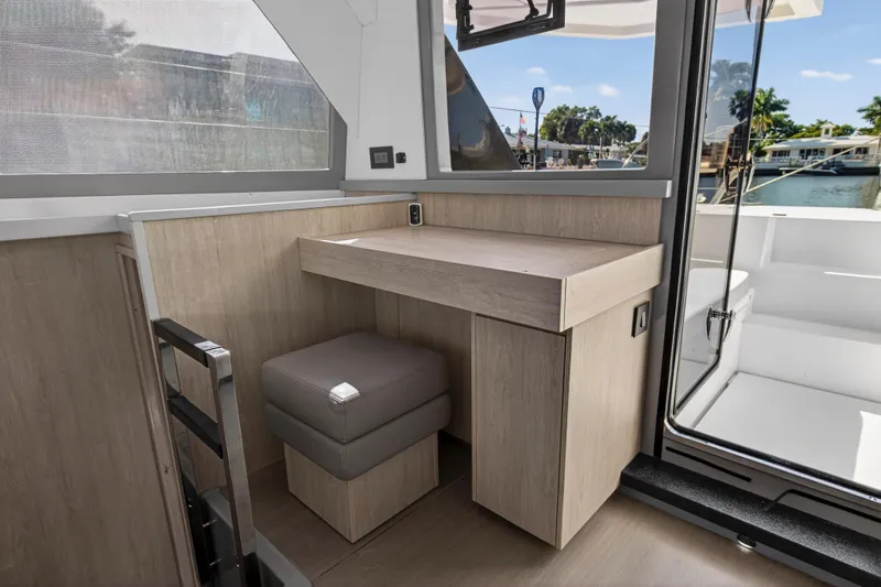Slide: The Image of Modern interior of 2019 Leopard 45 yacht with wooden desk and cushioned seat. - 20