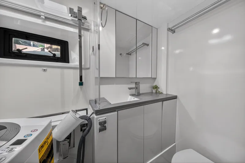 Slide: The Image of Modern bathroom in 2019 Leopard 45 yacht with sleek fixtures and washing machine. - 23