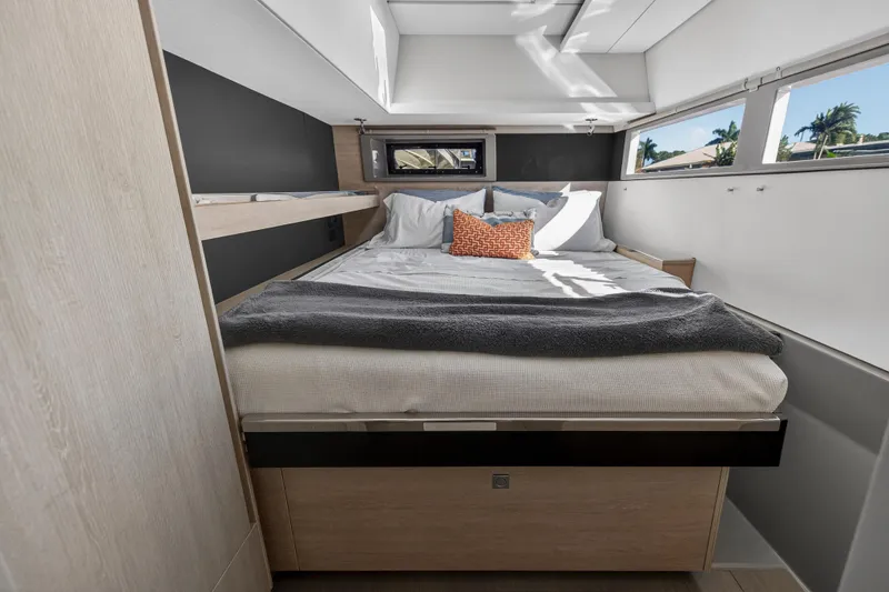Slide: The Image of Luxurious bedroom interior of 2019 Leopard 45 yacht with modern design and large windows. - 24