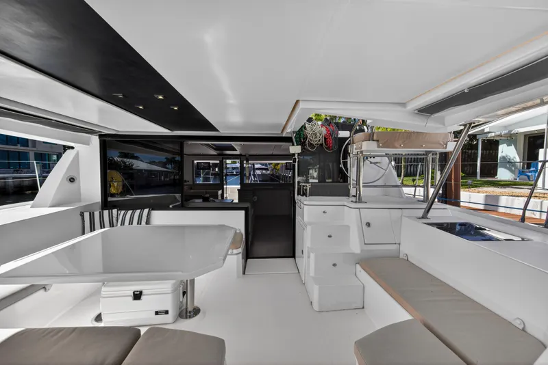 Slide: The Image of Spacious interior of a 2019 Leopard 45 catamaran with modern seating and dining area. - 3
