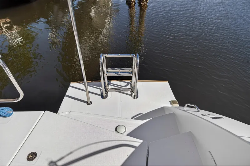 Slide: The Image of Stern view of 2019 Leopard 45 catamaran with swim ladder and water reflection. - 44