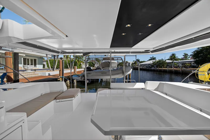 Slide: The Image of 2019 Leopard 45 yacht interior with spacious seating and waterfront view. - 5