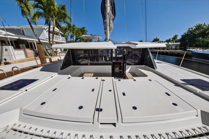 Slide: The Image of 2019 Leopard 45 catamaran docked, showcasing spacious deck and modern design. - 55