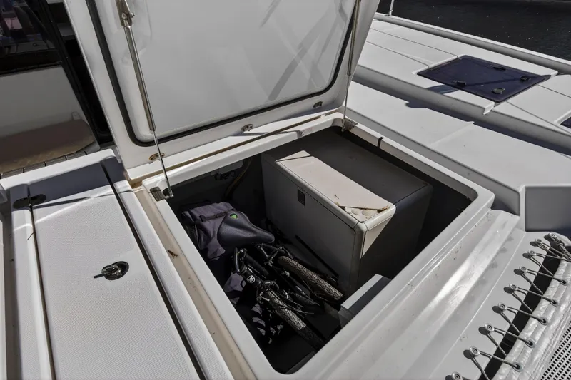 Slide: The Image of Open storage compartment on 2019 Leopard 45 yacht with bicycle and equipment inside. - 57