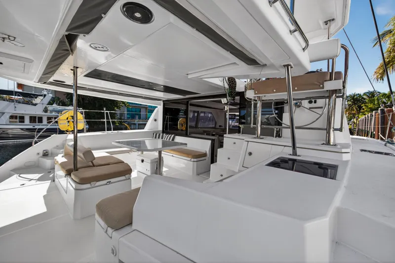 Slide: The Image of Spacious deck of 2019 Leopard 45 catamaran with seating and dining area. - 6