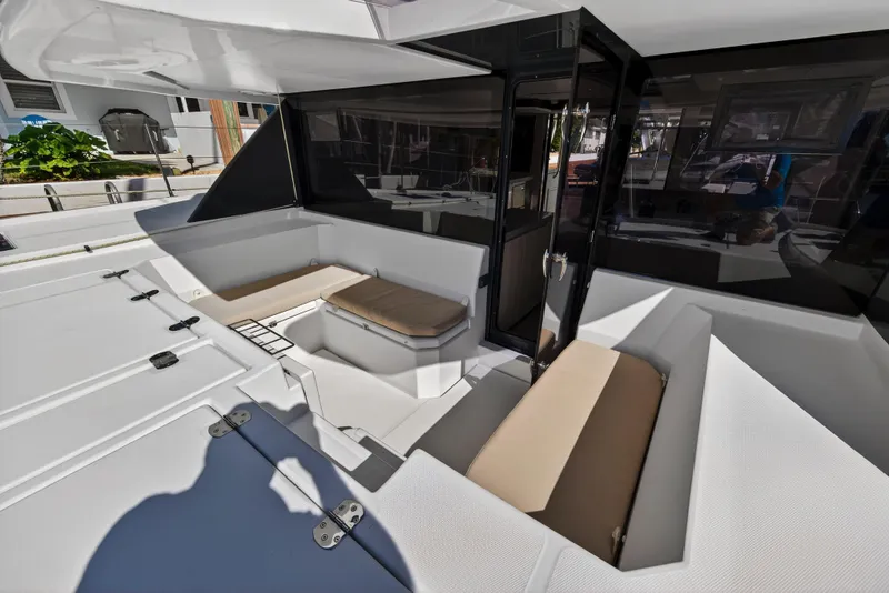 Slide: The Image of 2019 Leopard 45 yacht cockpit with cushioned seating and sleek design. - 60