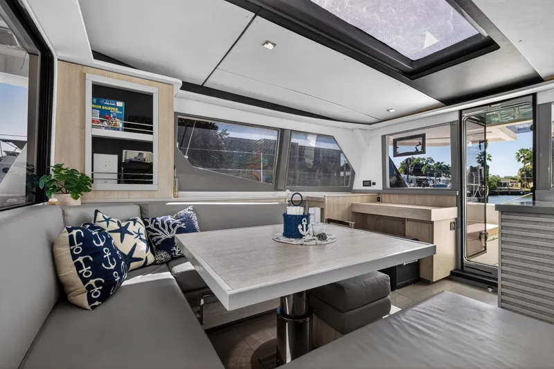 Slide: The Image of Luxurious interior of 2019 Leopard 45 yacht with modern dining area and nautical decor. - 77