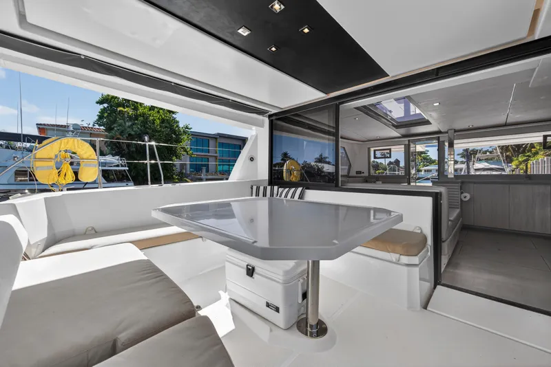 Slide: The Image of Luxurious 2019 Leopard 45 catamaran interior with modern seating and dining area. - 8
