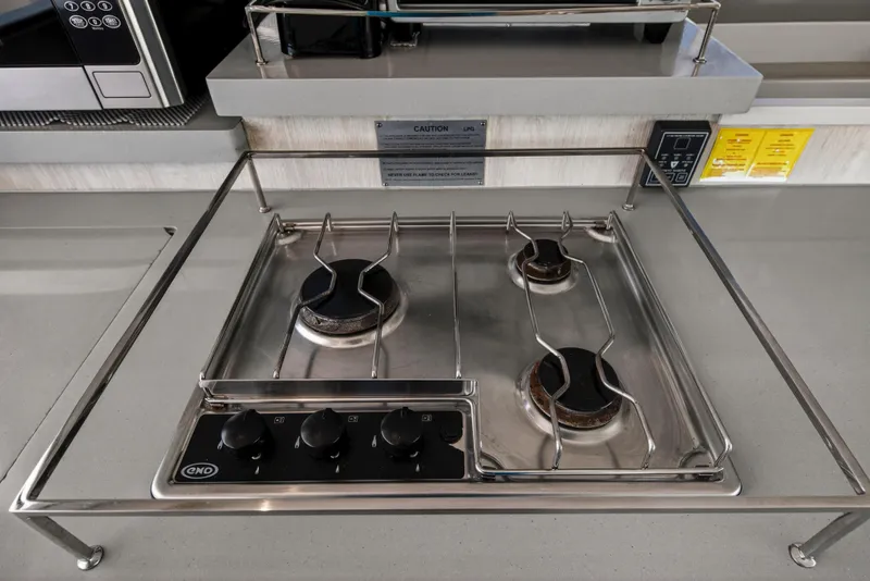 Slide: The Image of Stainless steel gas stove with three burners on a Leopard 45, 2019 model yacht. - 83
