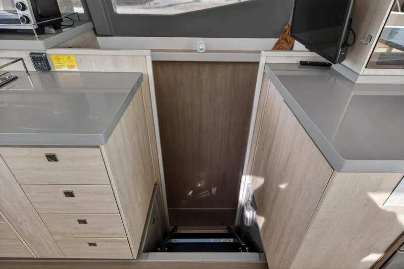 Slide: The Image of Interior of 2019 Leopard 45 yacht, featuring modern cabinetry and sleek countertops. - 87