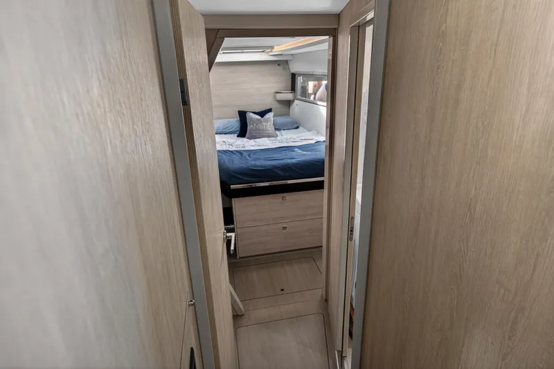 Slide: The Image of Interior of 2019 Leopard 45 yacht showing cozy bedroom with wooden finish. - 89