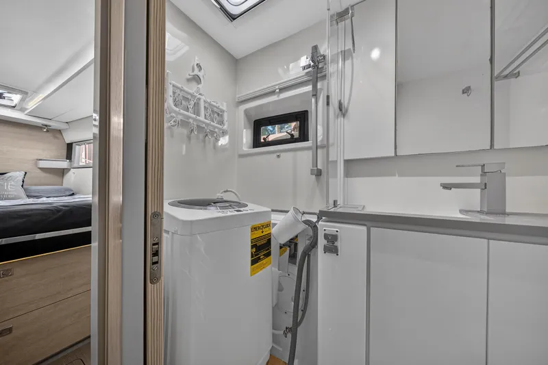 Slide: The Image of Modern Leopard 45 yacht interior with bedroom and bathroom, featuring sleek design and compact amenities. - 92