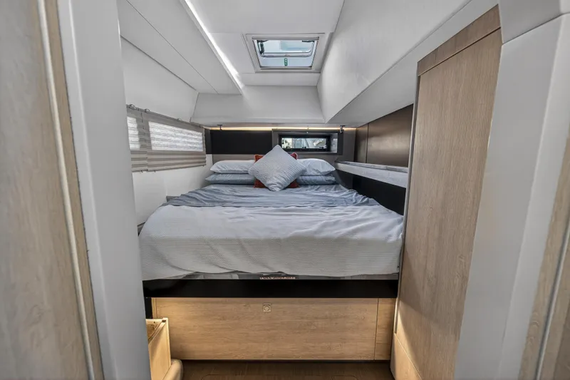 Slide: The Image of Luxurious cabin interior of 2019 Leopard 45 yacht with modern bedding and natural light. - 95