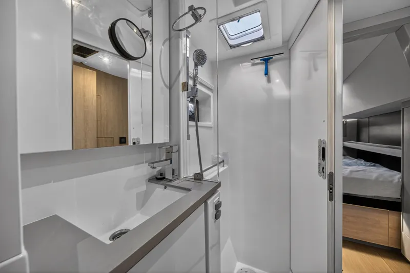 Slide: The Image of Modern bathroom interior on a 2019 Leopard 45 yacht, featuring sleek fixtures and a shower. - 98