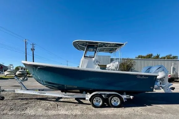 The Image of 2026 Pair Customs 24 Center Console DV Offshore boat on trailer, side view. - 0