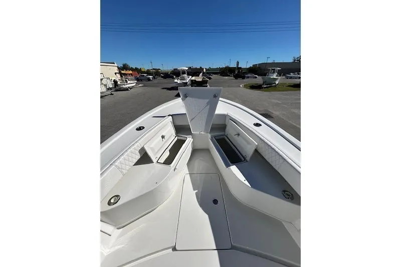 Slide: The Image of 2026 Pair Customs 24 Center Console DV Offshore boat interior with open storage compartments. - 12