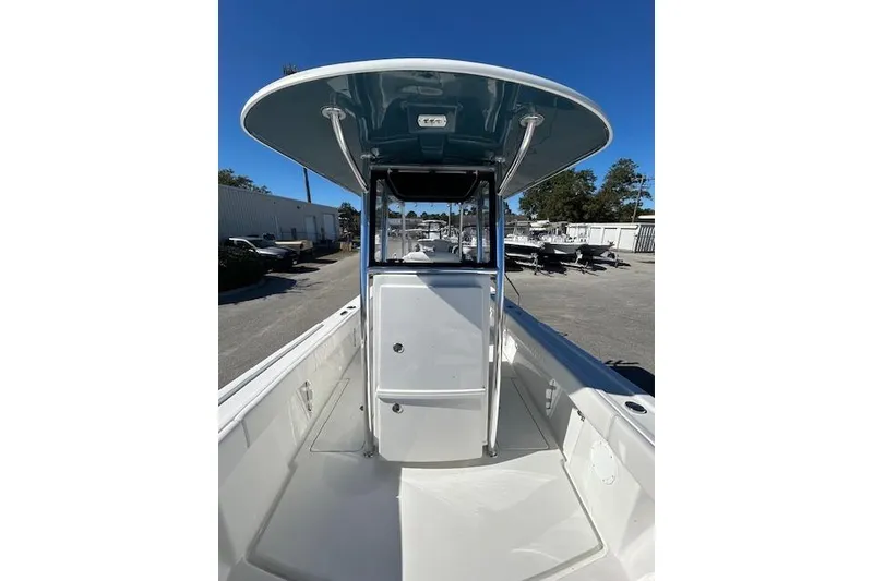 Slide: The Image of 2026 Pair Customs 24 Center Console DV Offshore boat, sleek design, spacious deck, sunny day. - 13