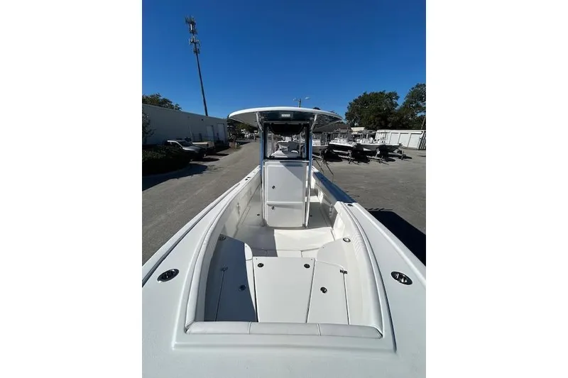 Slide: The Image of 2026 Pair Customs 24 Center Console DV Offshore boat, sleek design, spacious deck, clear sky. - 14