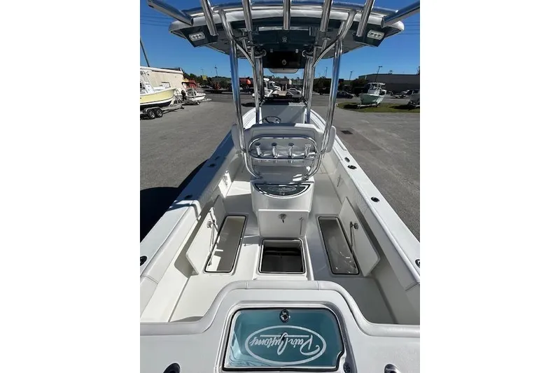 Slide: The Image of 2026 Pair Customs 24 Center Console DV Offshore boat interior with seating and storage compartments. - 15