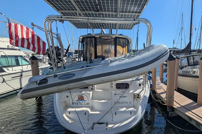 Slide: The Image of Hunter 450 Passage 2002 sailboat with dinghy and solar panels at marina, Charleston, SC. - 2