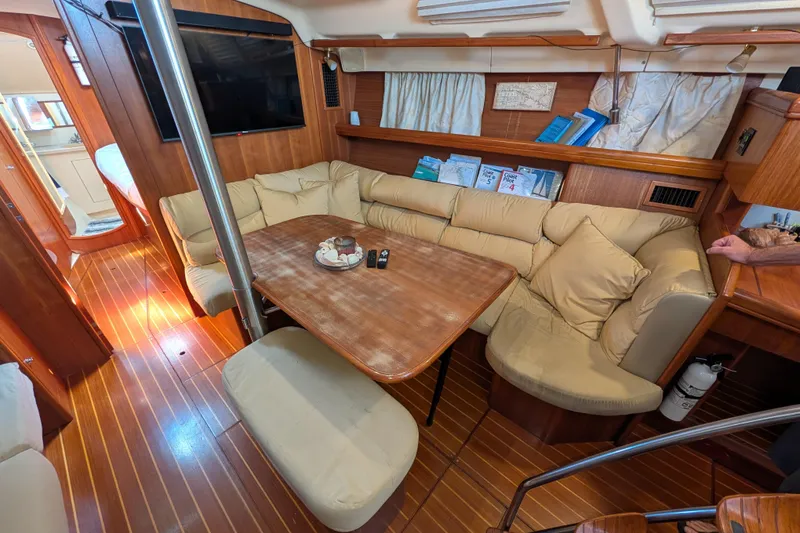 Slide: The Image of Luxurious interior of 2002 Hunter 450 Passage yacht with cozy seating and wooden finishes. - 25