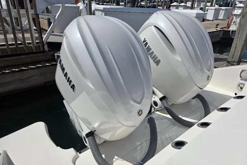 Slide: The Image of Twin Yamaha outboard engines on a 2026 Pursuit OS 325 Offshore boat. - 25