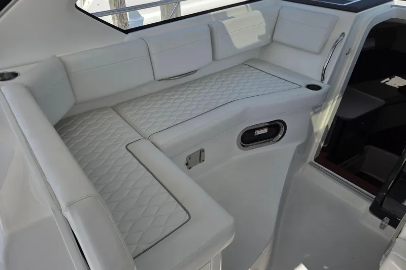 Slide: The Image of Luxurious seating area on a 2026 Pursuit OS 325 Offshore boat. - 27