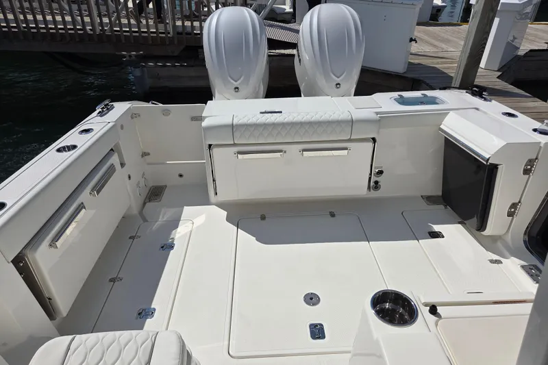 Slide: The Image of 2026 Pursuit OS 325 Offshore boat deck with seating and storage compartments. - 34