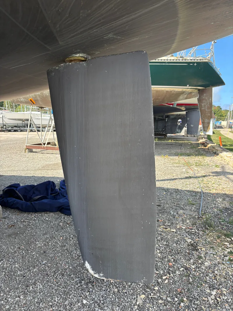 Slide: The Image of Catalina 380 sailboat keel, 2000 model, on dry dock with clear blue sky. - 10