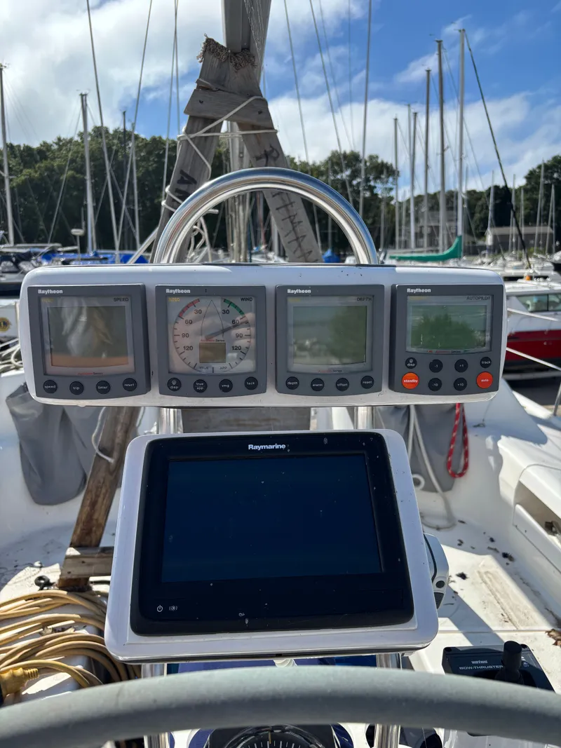 Slide: The Image of Cockpit of 2000 Catalina 380 sailboat with Raytheon and Raymarine navigation instruments. - 25