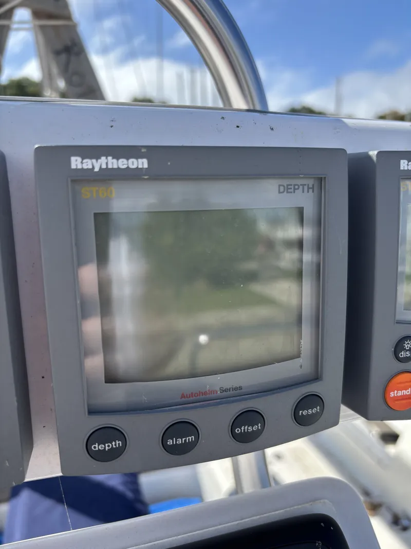Slide: The Image of Raytheon ST60 depth gauge on Catalina 380 yacht, 2000 model, with control buttons. - 29