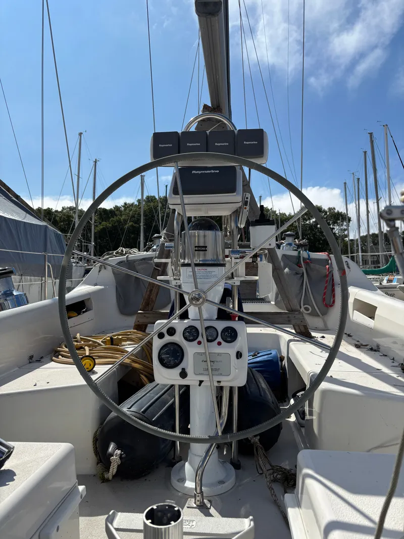 Slide: The Image of Steering wheel of a 2000 Catalina 380 sailboat with navigation instruments. - 42