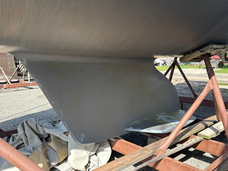 Slide: The Image of Catalina 380 sailboat keel on a stand, 2000 model, in a boatyard. - 7