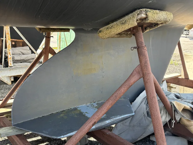 Slide: The Image of Catalina 380 sailboat keel supported by stands, 2000 model. - 8