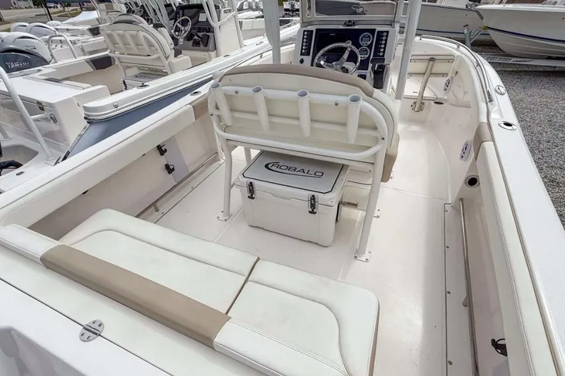 Slide: The Image of 2024 Robalo R222 Explorer boat interior with seating and console. - 3