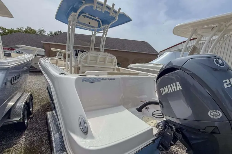 Slide: The Image of 2024 Robalo R222 Explorer boat with Yamaha engine, parked outdoors. - 4
