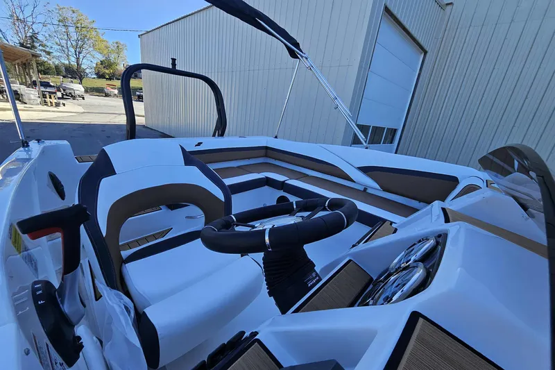 Slide: The Image of 2026 Starcraft SVX 191 OB boat interior with modern steering and seating design. - 11