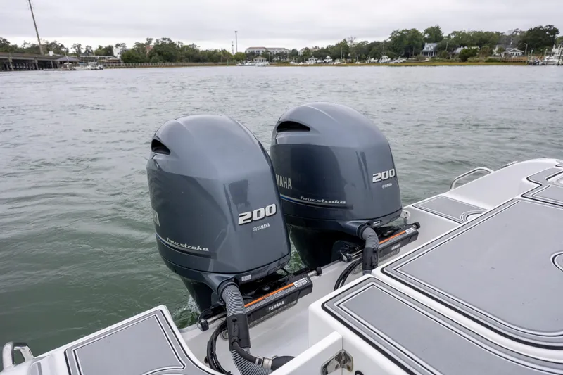 Slide: The Image of 2021 Sea Hunt Gamefish 25 with twin Yamaha 200 outboard motors on water. - 16