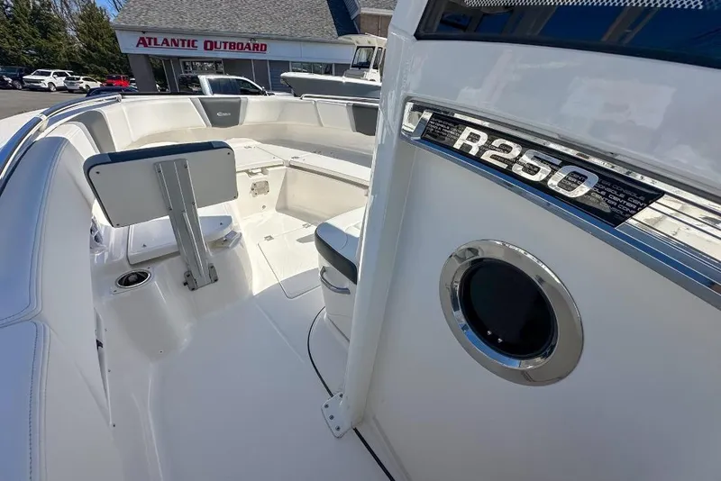 Slide: The Image of 2024 Robalo R250 Center Console boat interior at Atlantic Outboard dealership. - 10