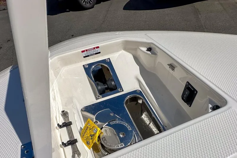 Slide: The Image of 2024 Robalo R250 Center Console boat anchor compartment detail. - 13