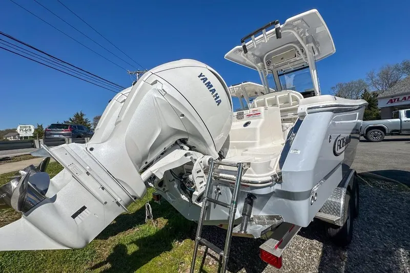 Slide: The Image of 2024 Robalo R250 Center Console boat with Yamaha engine, parked outdoors. - 15