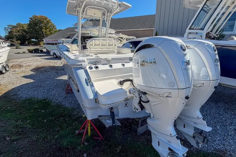 Slide: The Image of 2024 Robalo R250 Center Console boat with dual Yamaha outboard engines. - 16