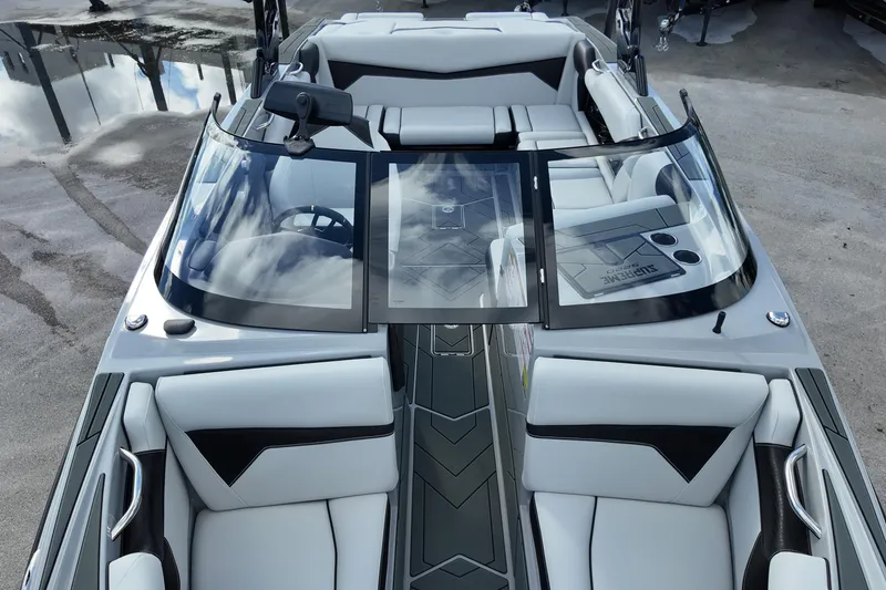Slide: The Image of 2025 Supreme S220 boat interior with sleek design and modern seating arrangement. - 22