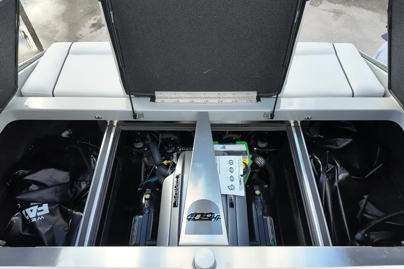 Slide: The Image of Engine compartment of 2025 Supreme S220 boat, showcasing powerful motor and components. - 28
