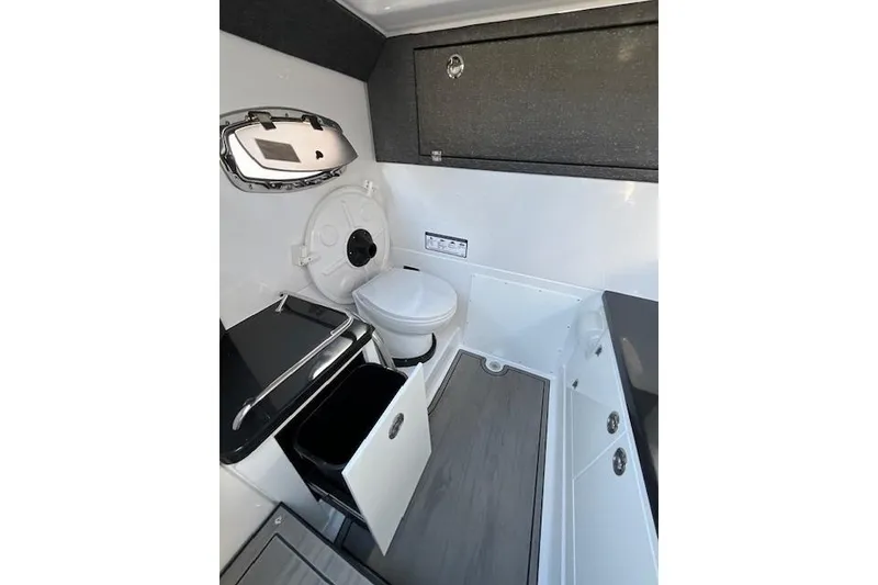Slide: The Image of Interior of 2026 Monterey Elite 27 SD boat bathroom with modern amenities. - 13