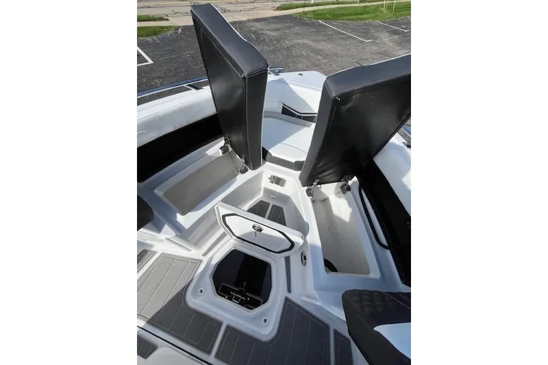 Slide: The Image of 2026 Monterey Elite 27 SD boat interior with seating and storage compartments. - 17