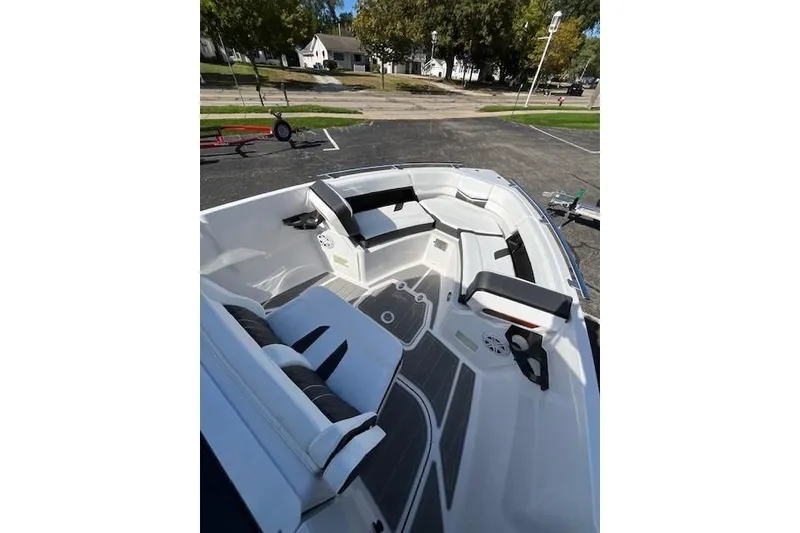 Slide: The Image of 2026 Monterey Elite 27 SD boat interior with sleek seating and modern design. - 18