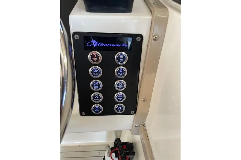 Slide: The Image of Control panel of a 1994 Albemarle Sportfish boat with labeled buttons. - 14