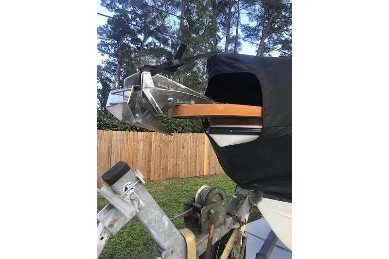 Slide: The Image of 1994 Albemarle Sportfish boat on trailer, covered, with anchor visible. - 18