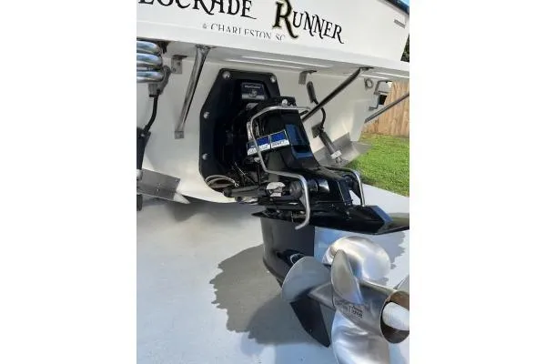 Slide: The Image of 1994 Albemarle Sportfish boat stern with propeller and engine details. - 19